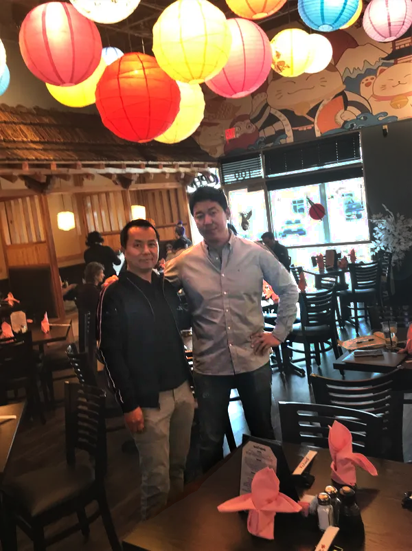 owners stand side by side inside Sunny's